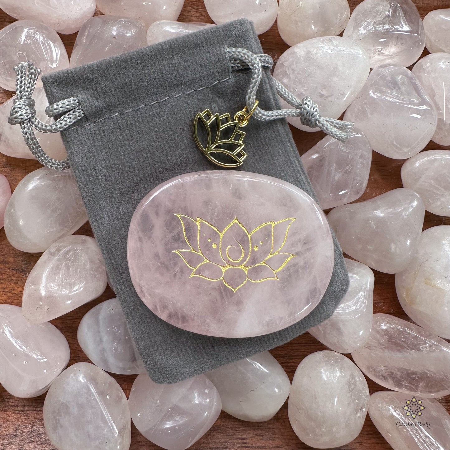 Engraved palm stone. Lotus flower in Rose Quartz