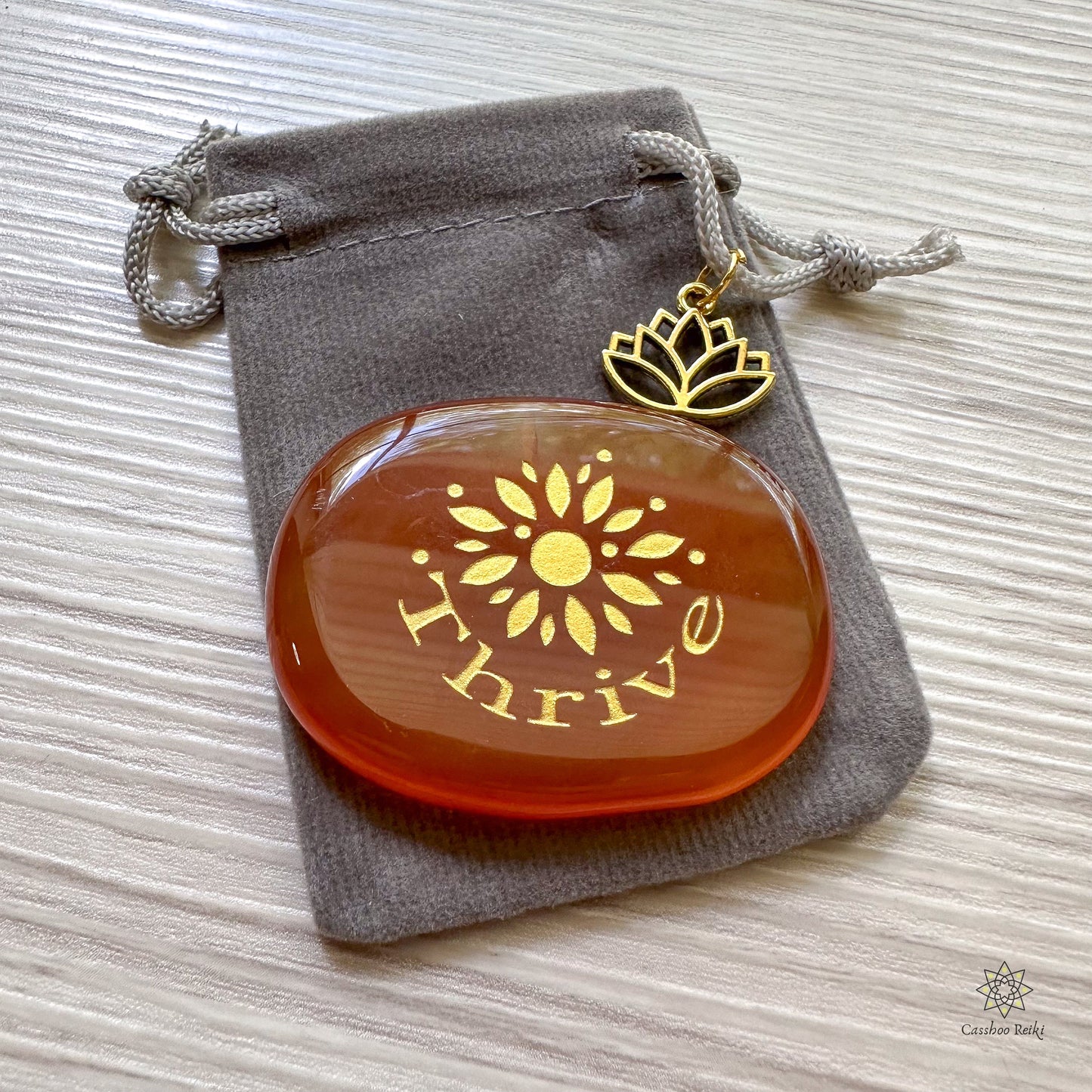 Engraved Palm Stone. Thrive in Carnelian | Sacral Chakra Stone