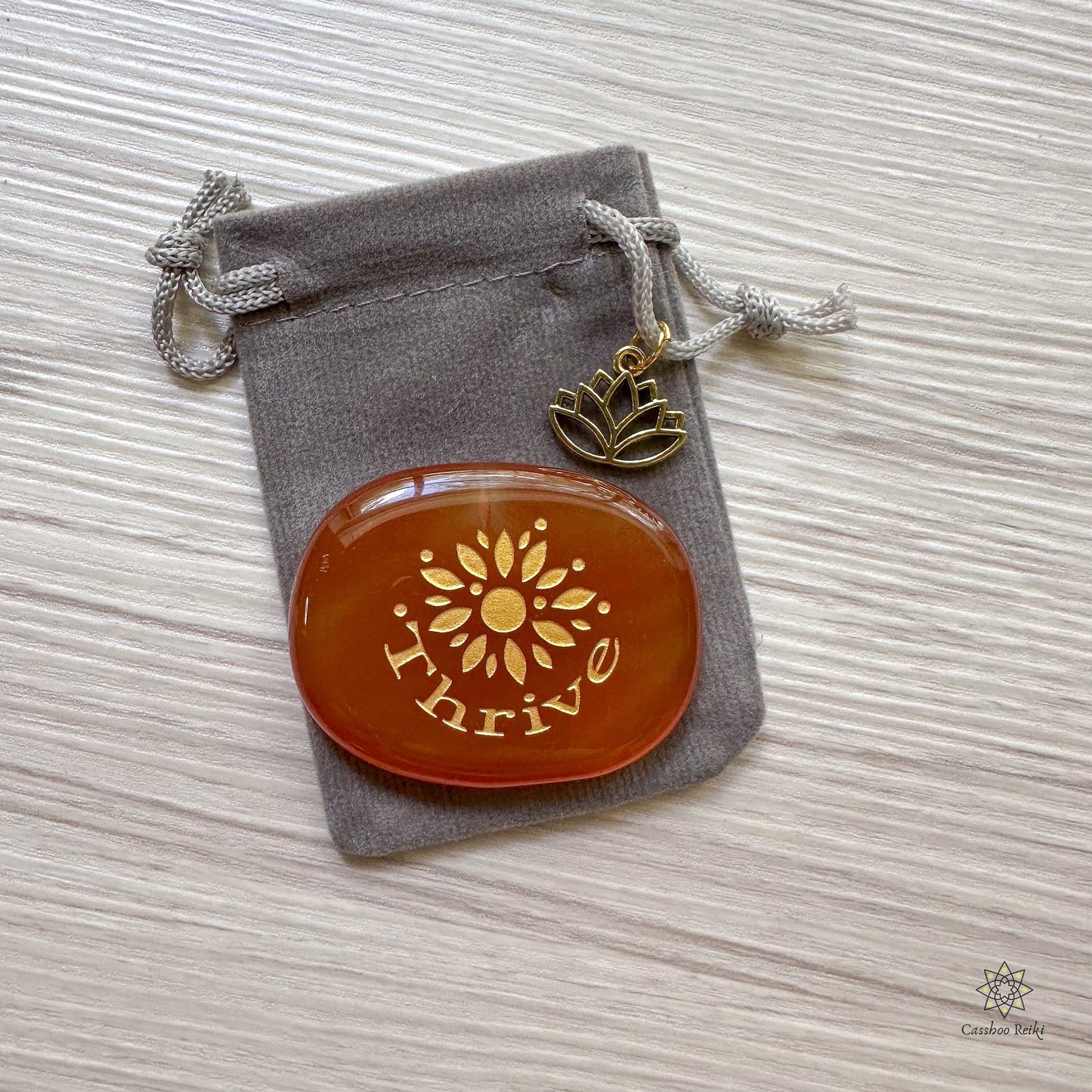 Engraved Palm Stone. Thrive in Carnelian | Sacral Chakra Stone